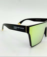 Sunglasses with a black frame and gold lenses on a white background
