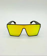 Sunglasses with yellow lenses and black frames on a white background