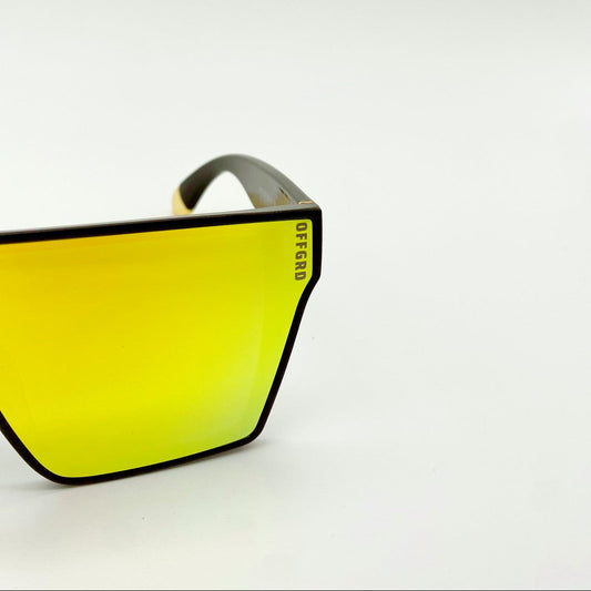 Sunglasses with yellow gold lenses on a white background
