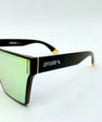 Sunglasses with black frame and gold lenses on a white background